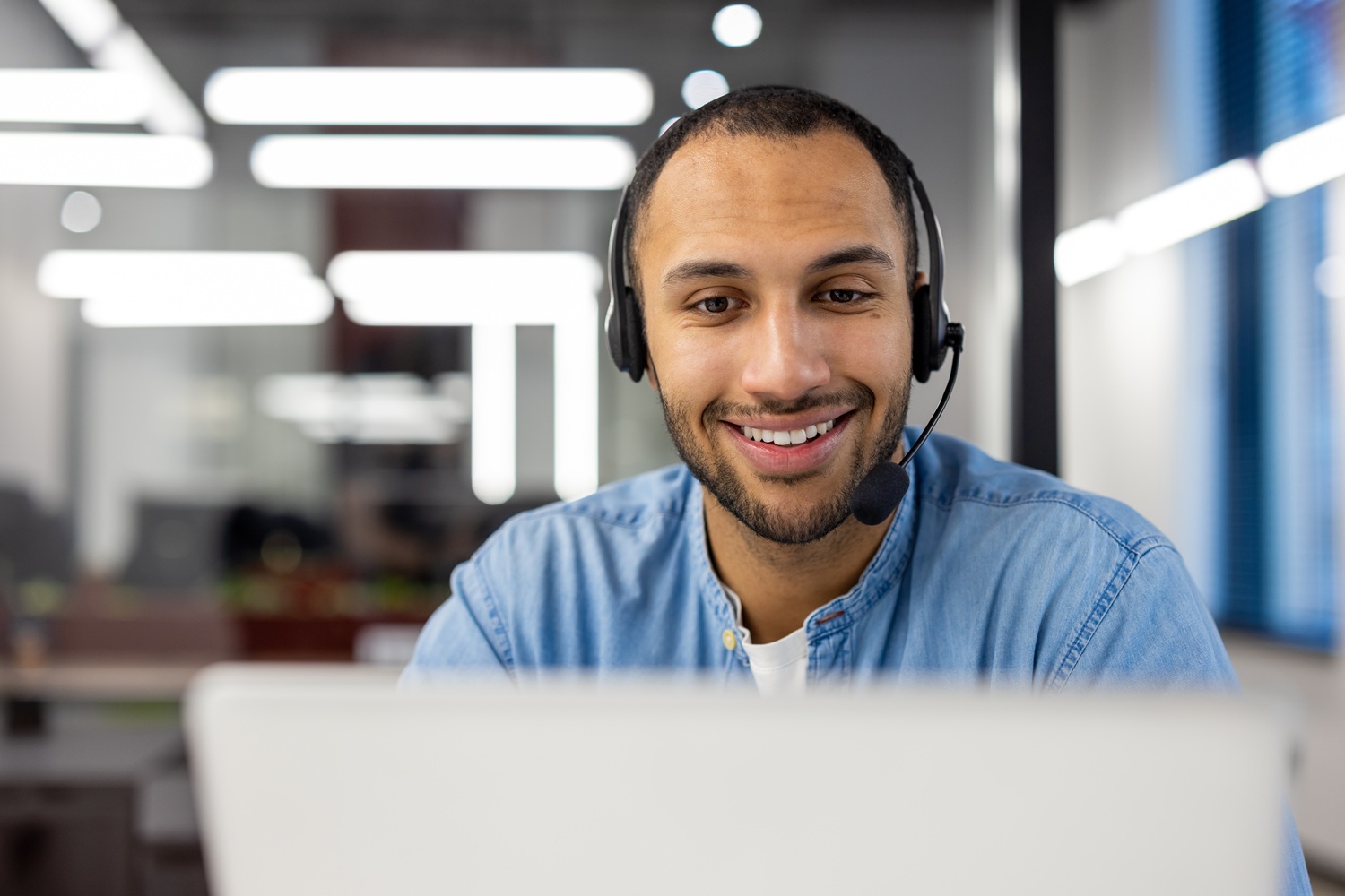 Friendly customer service agent working in modern office